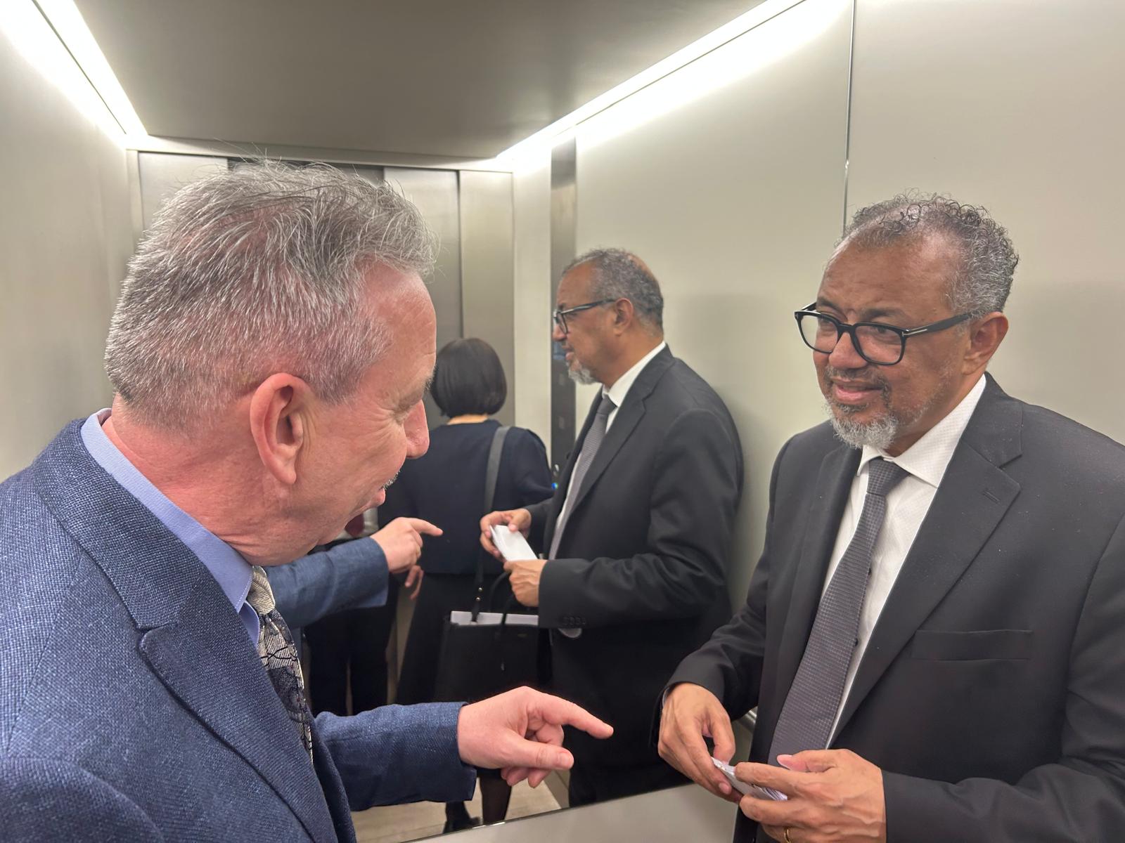Prof. Duncan Selbie with Dr. Tedros Adhanom Ghebreyesus, WHO Director General talking in an elevator